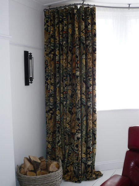 Full length curtains dramatically pooling onto the floor