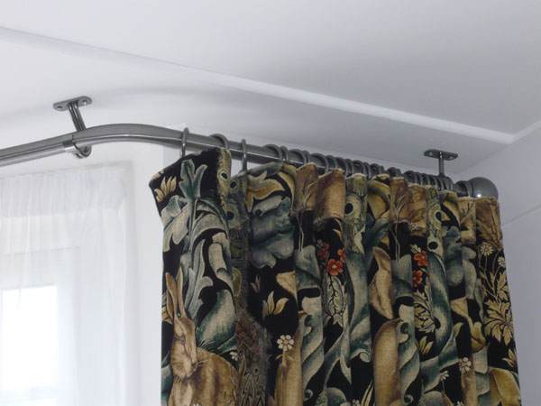 Dressing front and back under the pole helps the curtains to hang well