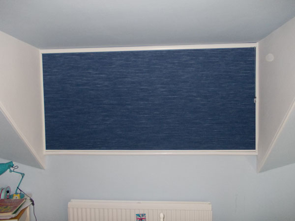 wide Duette blind lowered in its side channels