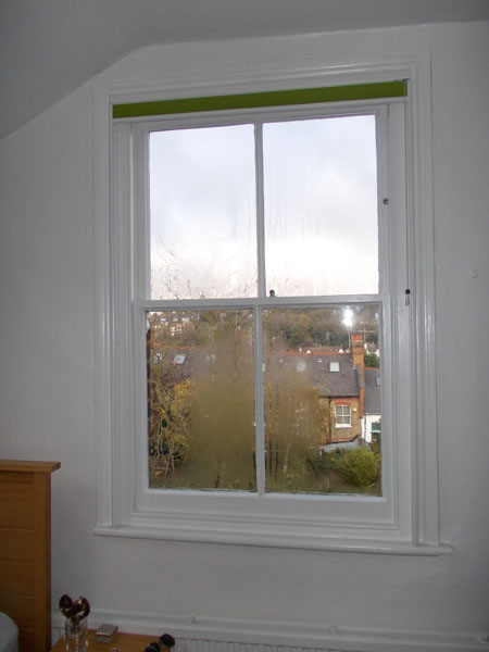 Green duette blind with side channels