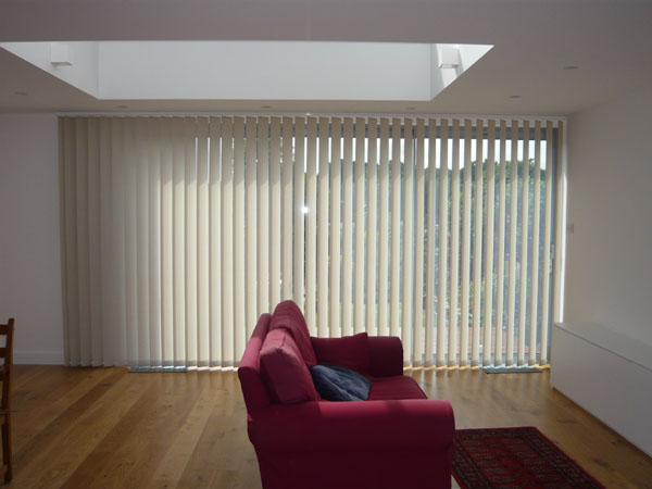 blind louvres rotated approximately 45 degrees to give some shade and privacy