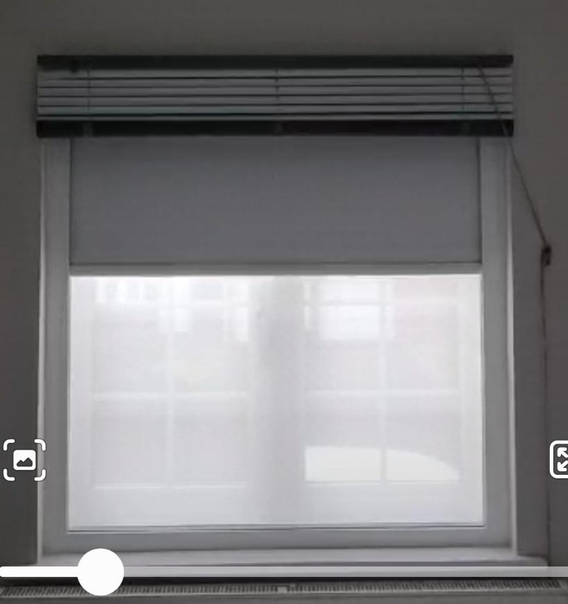 Fully Cassetted Blackout Roller Blind fitted behind existing blind in East  London lowered part way