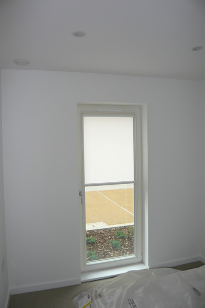 White framed nano blind, top down bottom up for door, blind covering top half of door