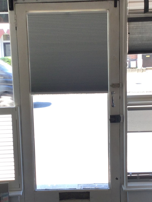 Trufit duette blind covering top half of glass door