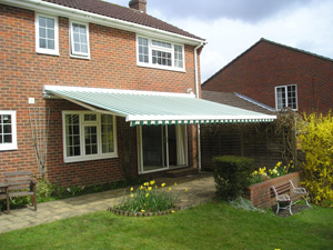 Bahamas patio awning with lighting rig and wind sensor installed in Essex