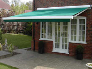 Bahamas patio awning gives shade to this large expanse of glass in North London
