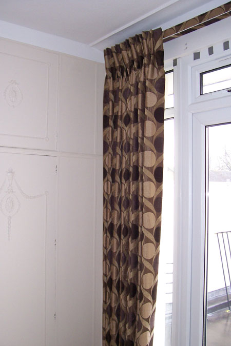 blackout lined curtains, pinch pleats and covered fascia 