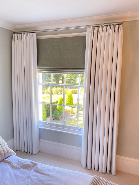 Euro pleat bedroom curtains fitted in Central London on a pole with blackout blind behind