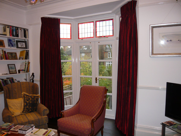 Faux silk interlined and pinch pleated on bay window track - open