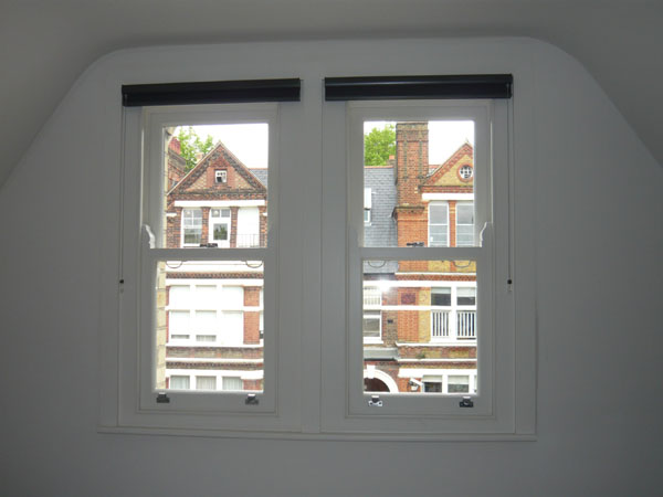 pair of windows with duette blinds fitted and stacked at top