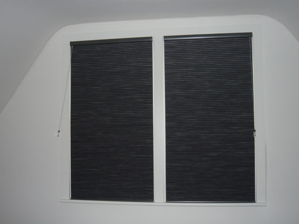 pair of duette blinds fitted to windows and lowered