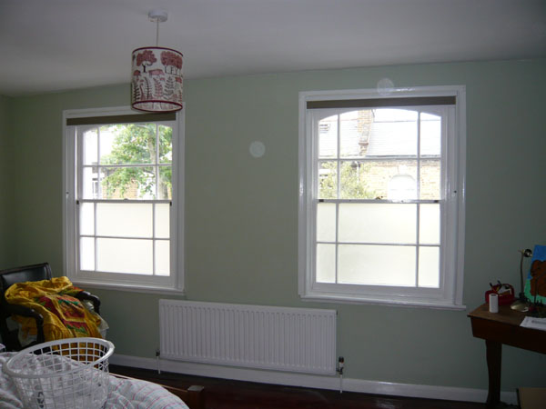 Duette blackout blinds fitted with side channels in this North London bedroom