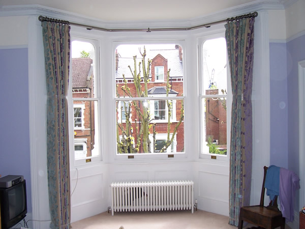 38mm two bend baypole fitted and curtains hung and curtains dressed and tied to set the pleats