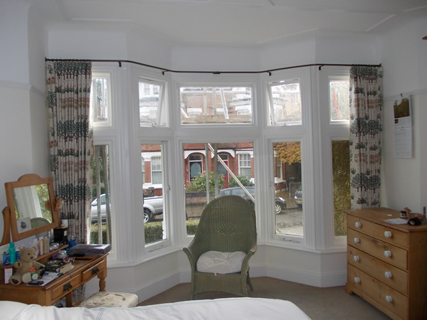 19mm wall to wall reverse bend baypole fitted in London the curtains stack back well