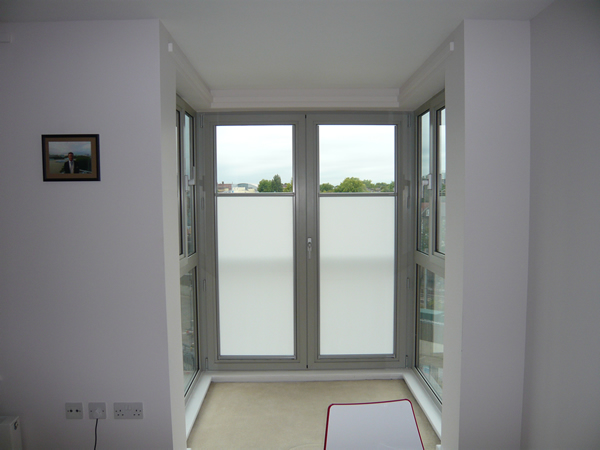 Luxaflex Nano blinds fitted to a pair of balcony doors in Central London