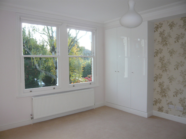 simple white roller blinds installede in Muswell Hill - Finchley