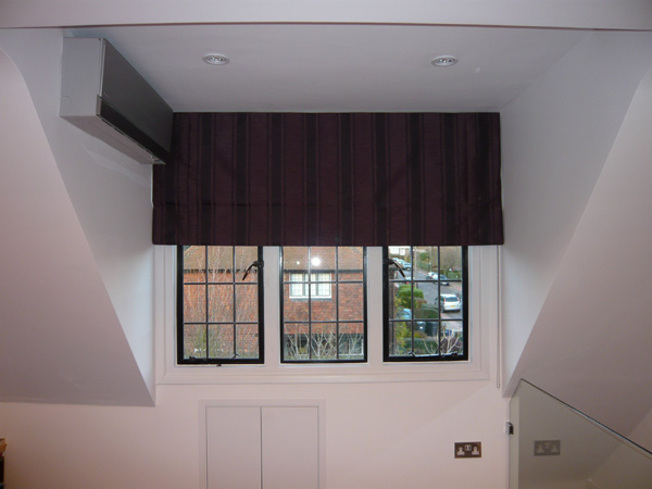 Blackout roman blind fitted in Essex, lowered halfway