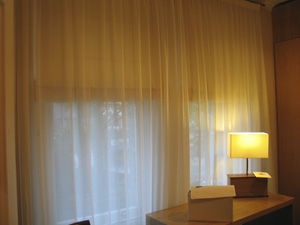 blackout roman blinds with a voile curtain for privacy and to soften the overall effect Highgate