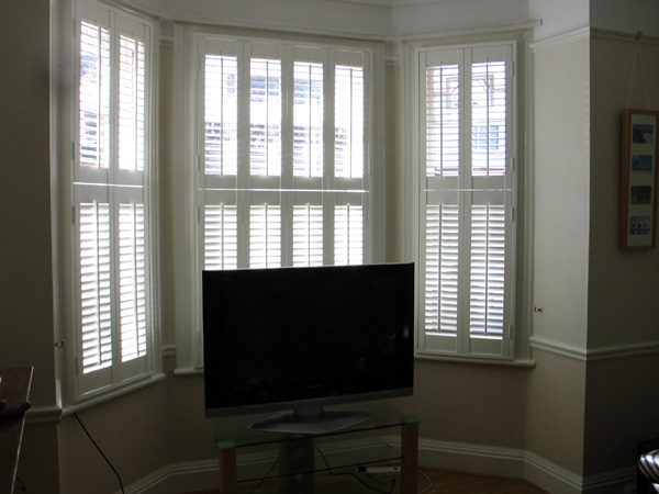 Wooden shutters with 47mm louvres, tier on tier in silk white 