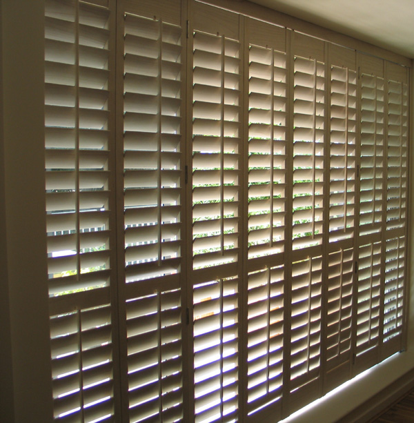 Wooden Shutters with 89mm louvres, tracking system, installed Central London 