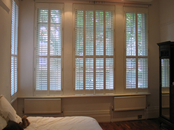 MDF shutters. Tall and narrow suits MDF with lots of hinges to carry the weight