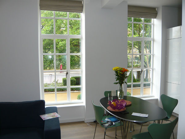 bottom up roller blinds, rolled up at the bottom of the windows
