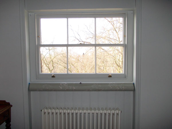 Bottom up roller blind positioned below the window