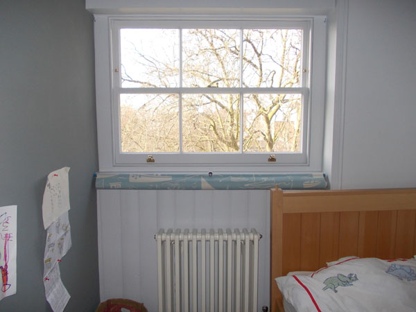A bottom up roller blind fitted below the window