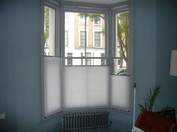 top down bottom up duette blinds covering bottom half of North London bay window - all at different heights