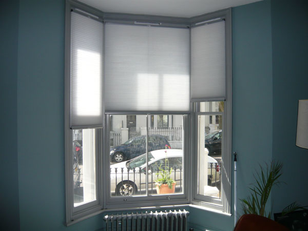 top down bottom up duette blinds covering top half of North London bay window