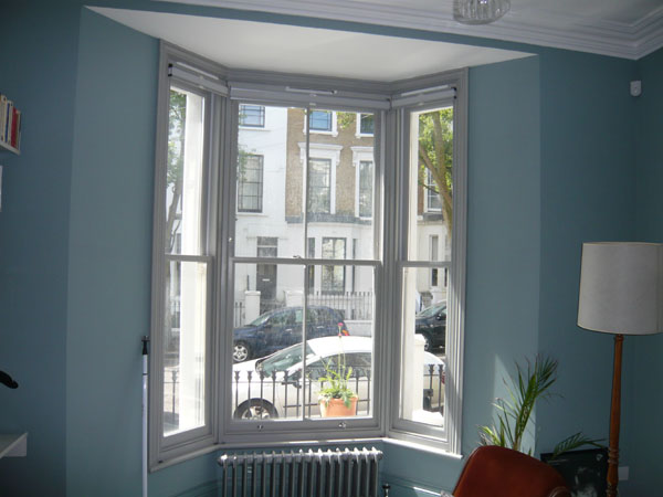 top down bottom up duette blinds stacked at the top of North London bay window