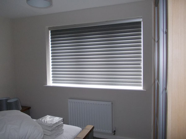 Luxaflex Bon Soir Silhouette shade lowered for room darkening effect, there is a gap at the bottom to allow the blind to rotate