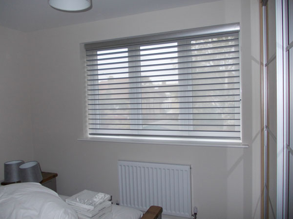 Luxaflex Bon Soir Silhouette shade voile lowered for privacy, space at bottom for rotation 