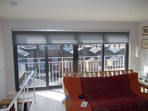 Luxaflex Silhouette blinds partially lowered from their silver headrails