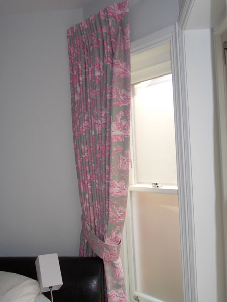 Manuel Canovas curtains held back with a tie back