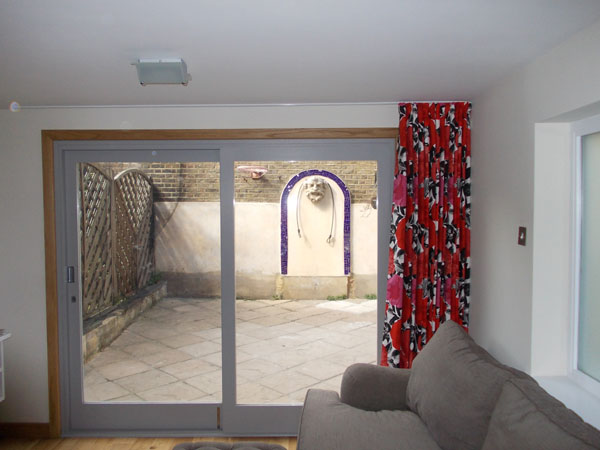 A single wave style curtain in Prestigious Madone Poppy stacked back