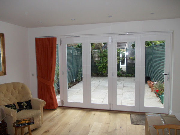 Patio doors with white metropole installed and single wave system curtain hung