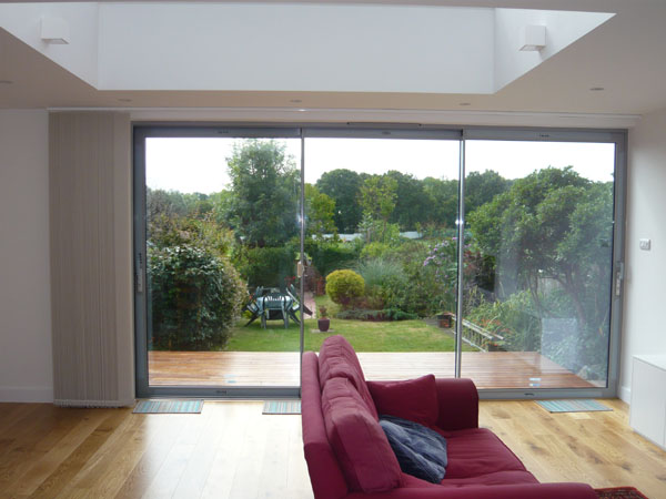 blind now fully stacked back onto the left hand wall adjacent to the patio doors