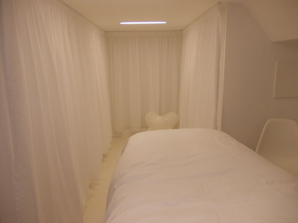 white voile curtains attached on velcro rails for easy cleaning