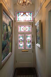 Brass rising portiere fitted to a front door in Central London