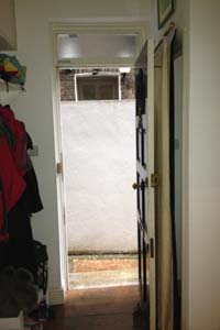 Portiere rod and interlined curtain fitted to Front Door in North London - the door is open