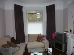 Faux suede curtains on a track with bottom up blinds fitted to UPVC windows West Hampstead