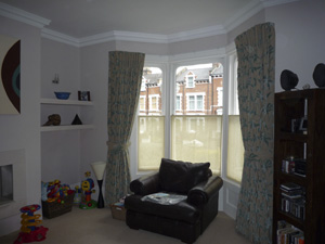 Corded metal track on top edge of window frame Highgate