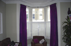 Interlined, pinch pleated silk curtains on baypole with cafe shutters Crouch End