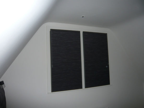 Blackout Duette blinds with side channels - here photographed with flash from where the bed is