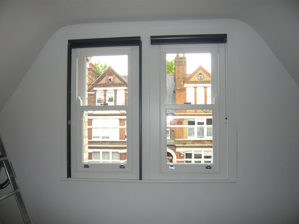 Pair of duette blinds fitted, now one blind has had side channels installed