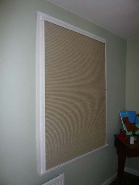 blackout duette blind fully lowered inside side channels