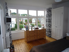 marimekko interlined and blackout on a corded steel bay window curtain track Muswell Hill