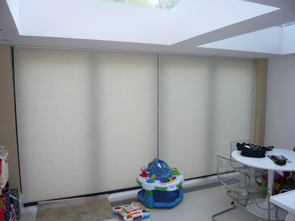 Duette blinds fitted at modern folding doors in London