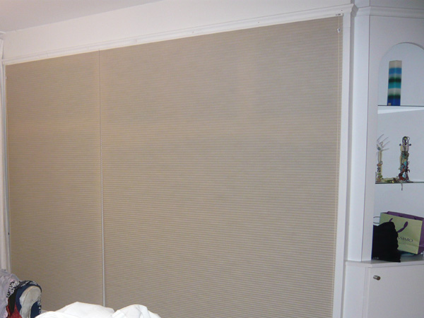 Duette blinds concealing wardrobe and shelves